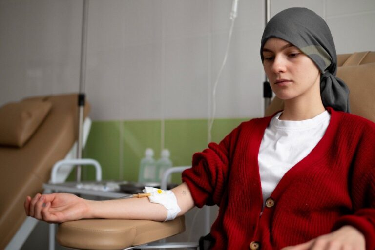 Patient receiving chemotherapy treatment under the care of Dr. M. Ponraj, expert in medical oncology in Palakkad.